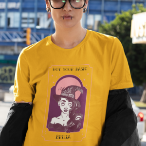 Short haired person with glasses wearing golden tee shirt