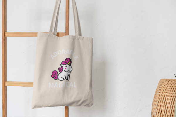 Adorable and Magical Tote Bag hanging on wooden decor